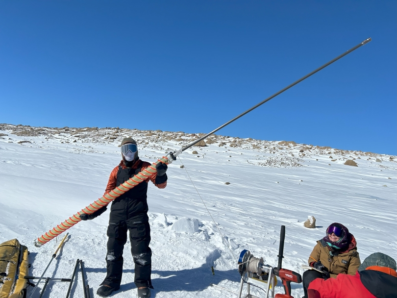 Jacob Chalif holding the tool for drilling into the ice