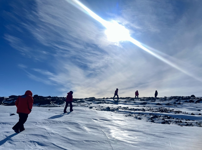 Researchers walking in Antarctica